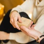 woman in white dress holding gold iphone 6