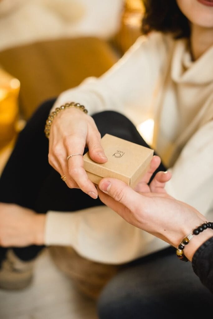 Woman in white dress holding gold iphone 6